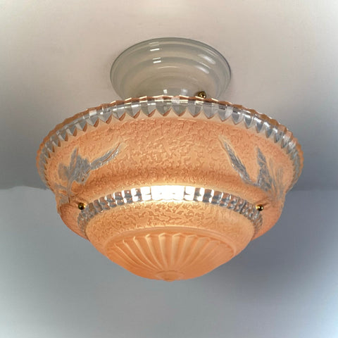 Peach floral etched glass flush mount ceiling light installed on ceiling