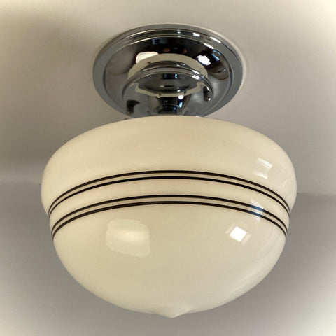 White milk glass schoolhouse semi-flush ceiling light with black pinstripes and chrome fitter