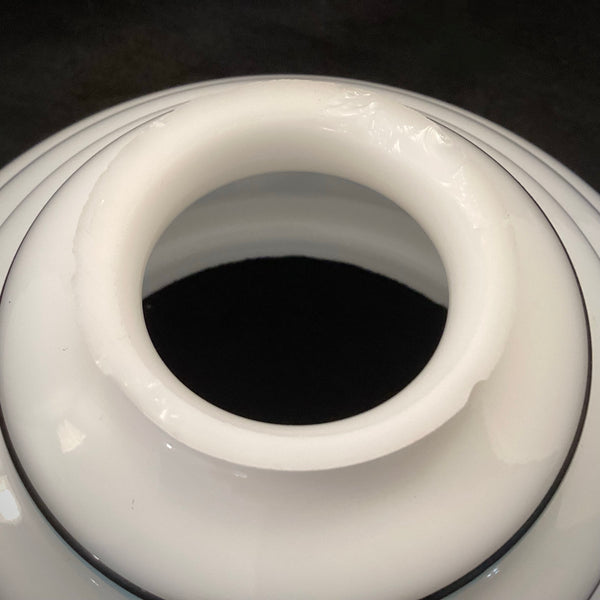 Detail of glass fitter opening on 1930s stepped shade with opal finish