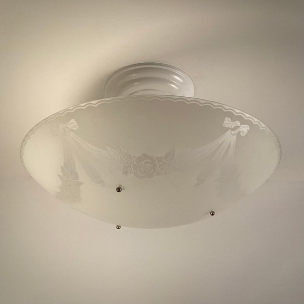 Front view of a 1950s postwar semi-flush ceiling light with enameled floral glass
