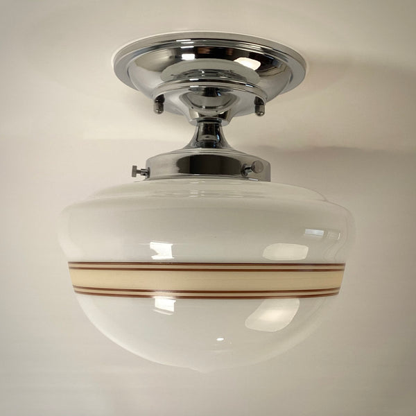 Side view of mocha stripe opal glass schoolhouse ceiling light with polished chrome mount