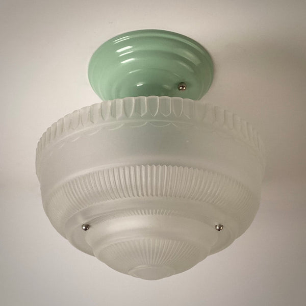 Vintage semi-flush ceiling light unlit, showing frosted ribbed glass bowl and green metal canopy