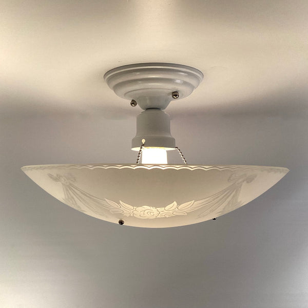 Side profile of a 1950s semi-flush ceiling light with shallow enameled glass bowl