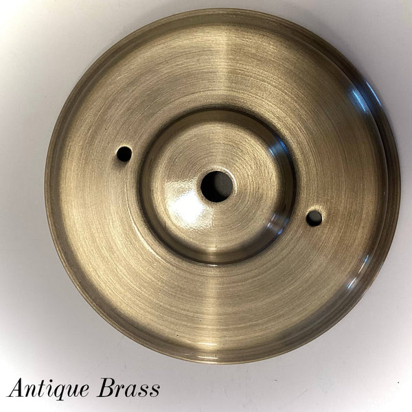 Antique brass round ceiling canopy with center wire opening and mounting screw holes, designed for vintage-style light fixture restoration and custom builds at Vintporium.