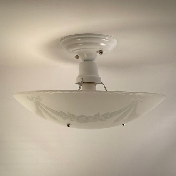 Detail of canopy and porcelain socket on a 1950s semi-flush ceiling light