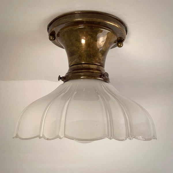Antique brass flush mount ceiling canopy with milk glass shade