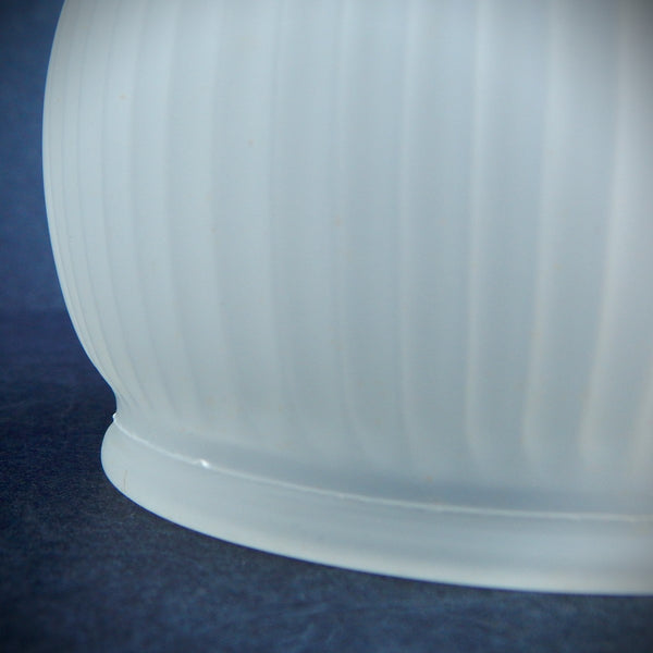 Vintage ribbed frosted glass light shade with bell-shaped form and satin finish, photographed from multiple angles against a dark background.