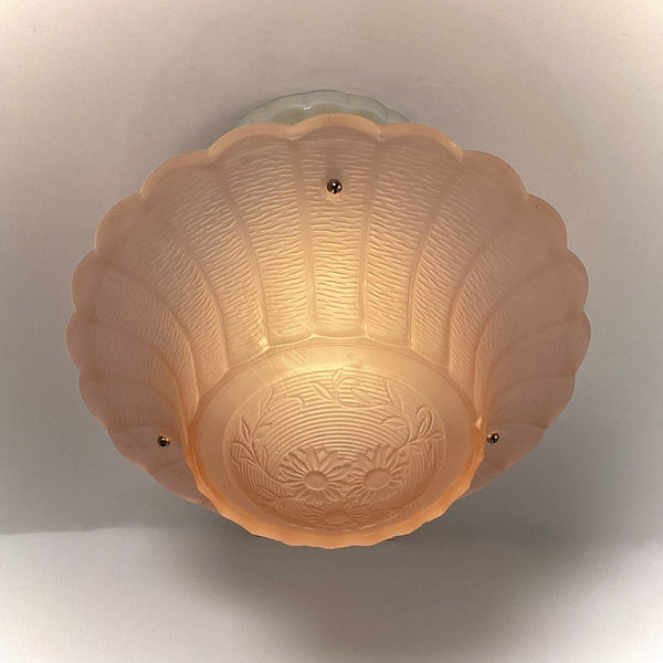 Bottom floral pattern of vintage peach Art Deco glass shade from the 1930s