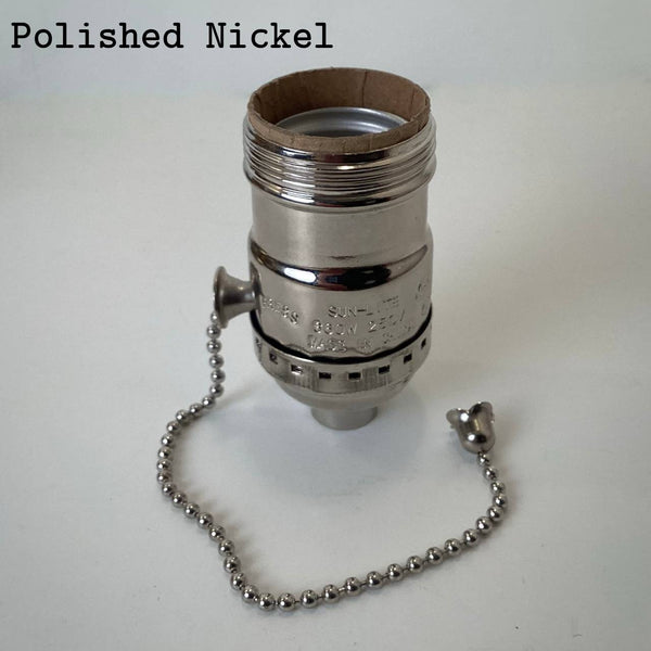 Polished nickel UNO pull-chain socket with reflective silver finish and chrome pull chain.