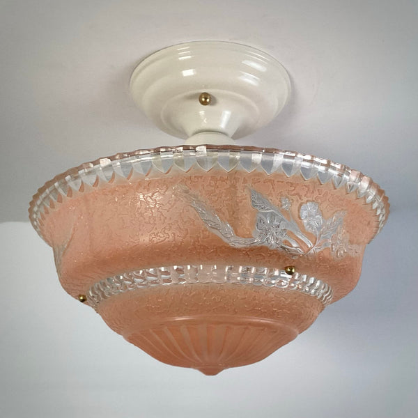 Peach etched glass flush mount ceiling light installed on ceiling, unlit view