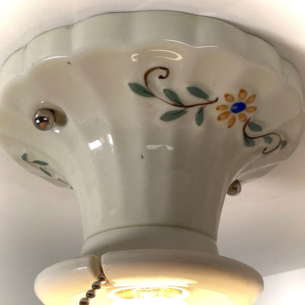 Hand-painted floral detail on vintage 1930s porcelain ceiling canopy
