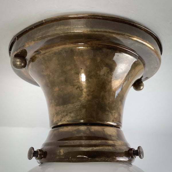Antique brass ceiling light canopy detail showing aged patina