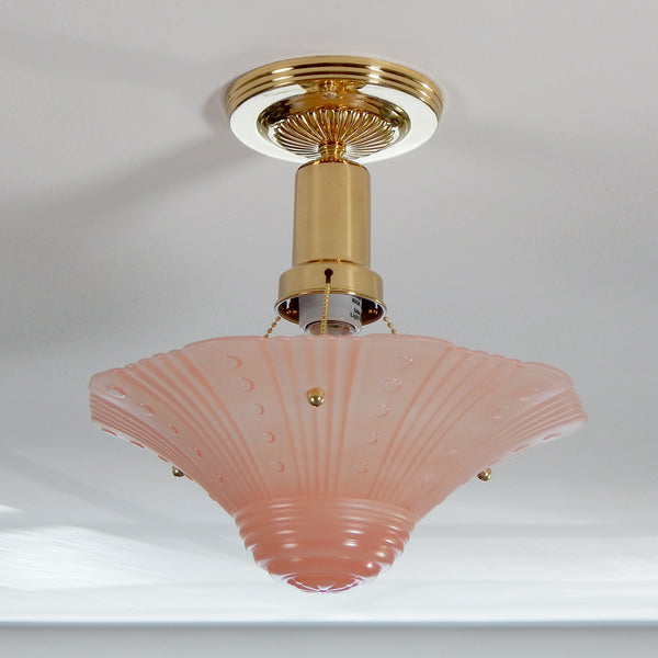 The semi-flush triple-beaded chain ceiling light fixture emerged with its earliest iterations in the 1920s through the 1940s. Triple-beaded chain fixtures of this period featured bold patterns and almost always had enameled finishes in pinks, blues, greens, whites, or bisque colors. The trend continued into the 1960s with lighter glass shades and silk-screened finishes instead of the hand-painted enameled finish. Available at www.vintporium.com
