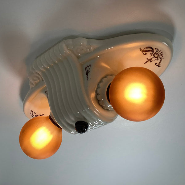 Vintage Flush Mount Porcelain Ceiling Light Fixture. This beautiful antique porcelain ceiling light fixture with uranium glass glaze features a classic 1930s design. Available at www.vintporium.com