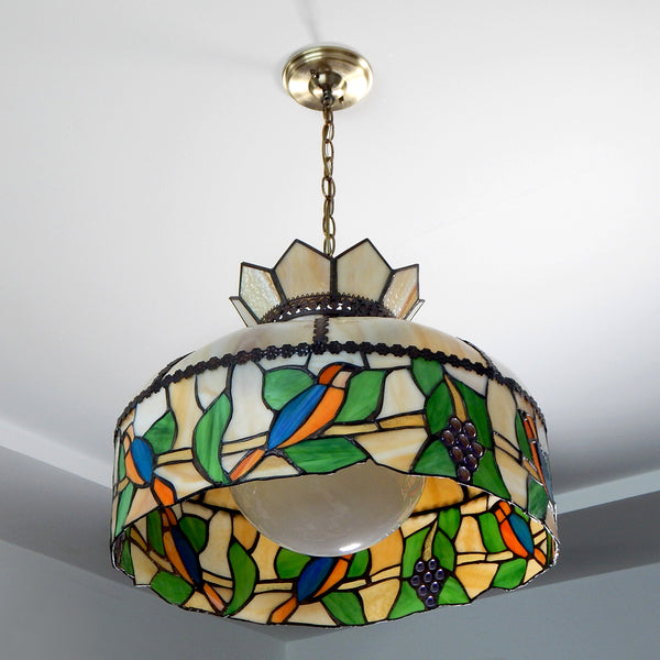 Vintage Slag and Stained Glass Ceiling Pendant Light Fixture. Slag glass was popular in the late nineteenth and early twentieth century. However, fortunately, there was a rebirth of interest in slag glass in the 1970s, and several producers developed lighting influenced by those old slag glass pieces. Available at www.vintporium.com