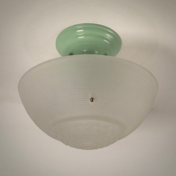 Jadeite-green semi-flush ceiling fixture with frosted ribbed glass bowl shade.