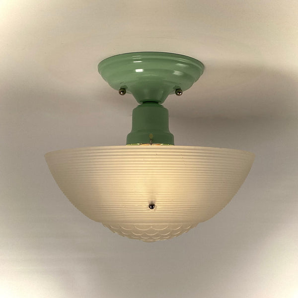 Vintage ceiling light with extended jadeite-green fitter and glowing ribbed glass shade