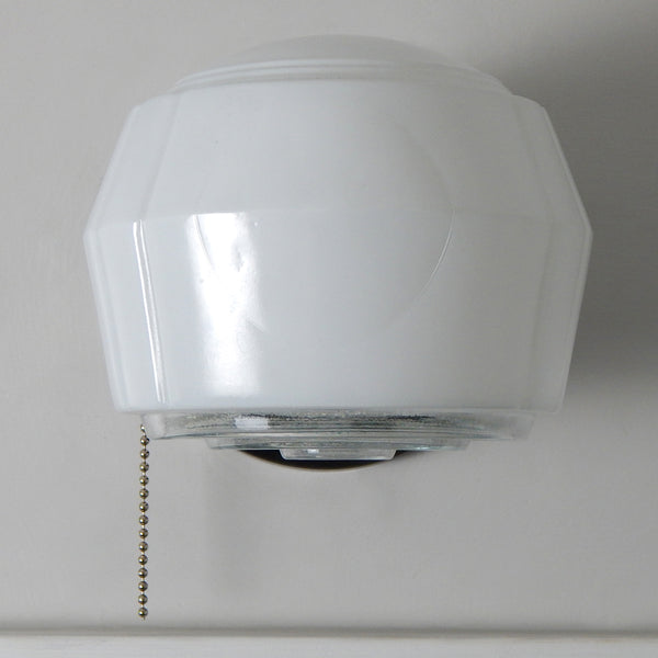 Post-War Era Pull Chain Sconce Vintage Glass Shade New Fixture Base. The fixture features a vintage enameled glass shade and a new pull chain fixture. The light comes with installation hardware, making it convenient to install. Available at www.vintporium.com