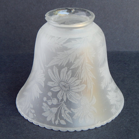 Frosted glass bell lamp shade with etched floral design, view from side.