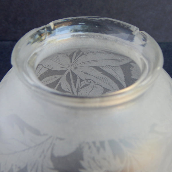 Close-up of fitter rim with chip on vintage glass lamp shade