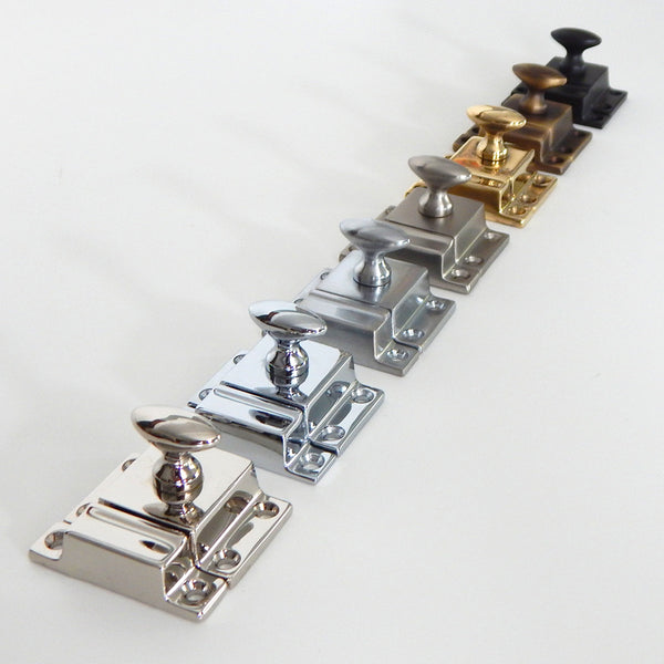 Vintporium's quality brass cupboard latches are available in Lacquer Free Polished Brass, Antique Brass, Polished Nickel, Brushed Nickel, Polished Chrome, Brushed Chrome, and Oil-Rubbed Bronze. The latches feature rounded slotted screws. Available at www.vintporium.com