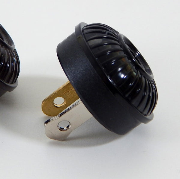 Early electric replica embossed ribbed motif bakelite plug. The plug features an insulator and polarized prongs.  Available at www.vintporium.com