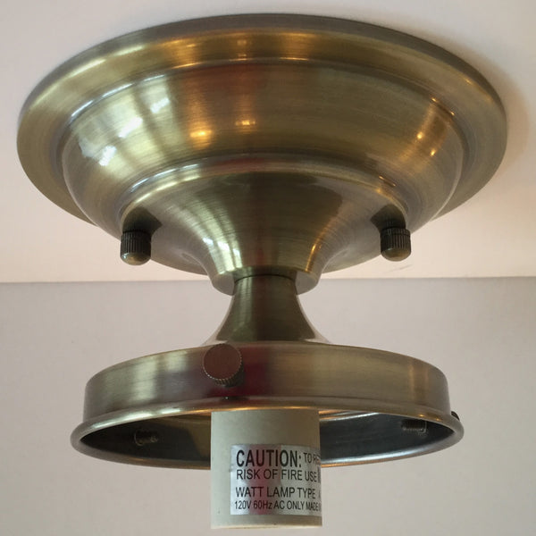 Bring new life to those old ceiling light fixtures by swapping out the old fixture bases for this Moderne 4 inch Schoolhouse Fixture. It will complement many glass shades with its crisp lines and complementary angles in your choice of antique brass, satin brass, black, bronze, polished nickel, and satin nickel finish.. Available at www.vintporium.com