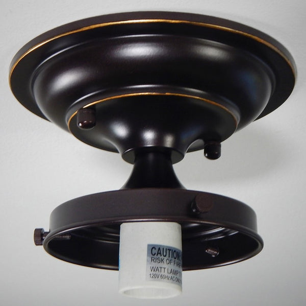 Bring new life to those old ceiling light fixtures by swapping out the old fixture bases for this Moderne 4 inch Schoolhouse Fixture. It will complement many glass shades with its crisp lines and complementary angles in your choice of antique brass, satin brass, black, bronze, polished nickel, and satin nickel finish.. Available at www.vintporium.com