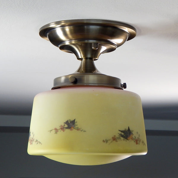 Delightfully painted yellow, and pink ceiling light adorned with robins and floral branches. The antique brass finish fixture is new and U.L.-listed. The light fixture comes with all the necessary hardware for easy installation. Available at www.vintporium.com