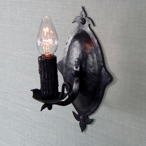 This 1930's antique sconce light fixture will fit well in any of the following Revival-style homes whether they be Spanish, Tudor, Storybook, or Craftsman. The fixture has been restored, detailed, and includes the hardware for easy installation. Available at www.vintporium.com