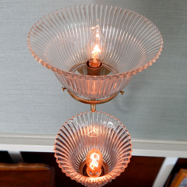 This renovated antique Victorian-era electric sconce has been rewired with numerous new parts added. Circa 1905ish, its naturally aged brass finish emphasizes its age and unique character. The fixture features new wiring, sockets, etc., and has been cleaned, yet not overly detailed. The sconce comes with mounting hardware making it convenient to install. Available at www.vintporium.com