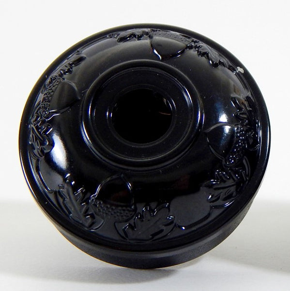 Early electric replica embossed acorn and oak leaf motif bakelite plug. The plug features an insulator and polarized prongs.  Available at www.vintporium.com